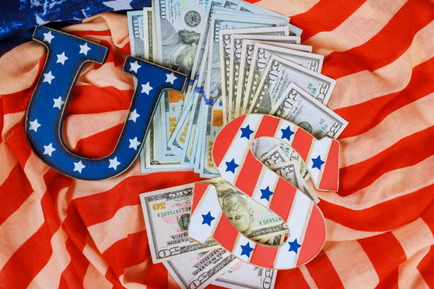 istock US currency arranged with decorative letters on an American flag background during a festive celebration 2193047468