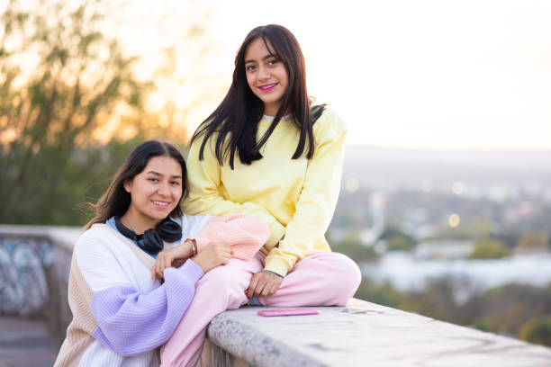istock Two best friends enjoying the sunset together 2193050717