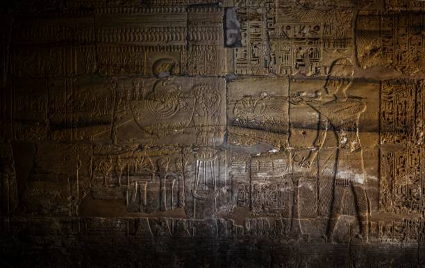 istock Ancient Egyptian hieroglyphs carved on a temple wall, showcasing intricate designs 2193050895