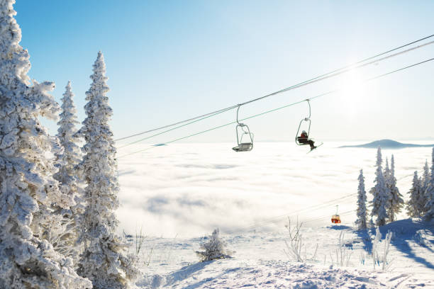 Black and white photo of a ski lift in the winter