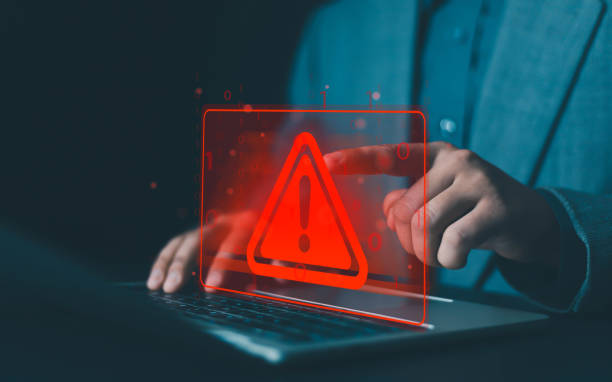 istock System hacked warning alert on laptop. error 404 alerts on a laptop, caution of spam in website digital Cyber attack on computer network, Virus, Spyware, Malware or Malicious software. Cyber security 2193058302