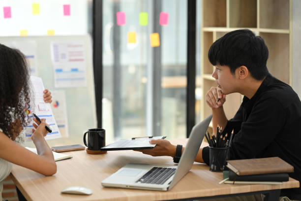 istock Two colleagues collaborating on business strategies in bright office 2193058668