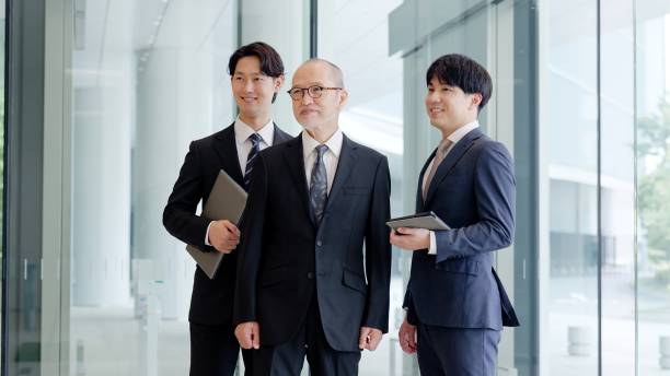 istock Smiling business person standing in the lobby 2193059533