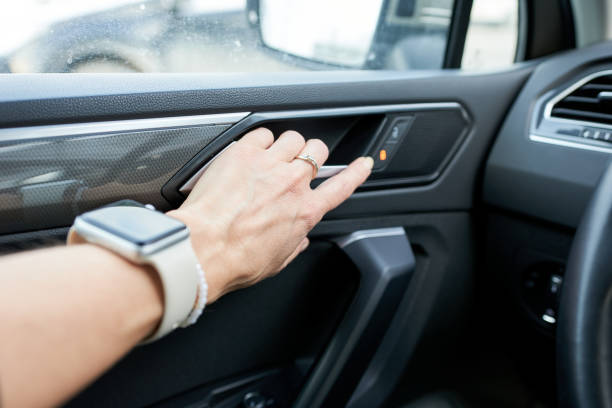 istock Woman's hand opens the car door. Unlock the door. 2193059683