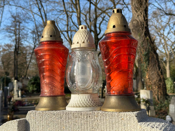 istock Lanterns on a tombstone in the public cemetery 2193059718