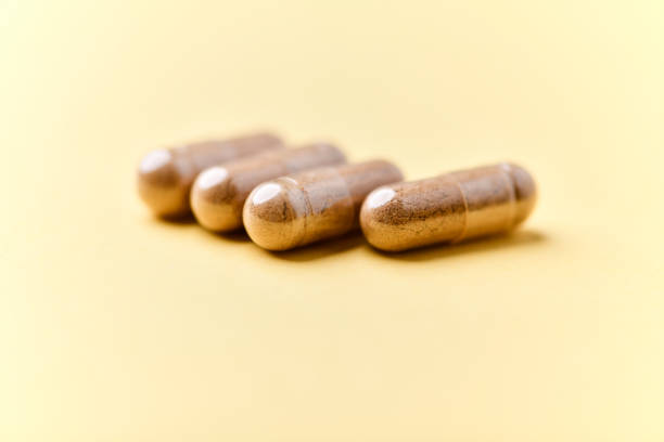 istock Carnitine capsules. Concept for a healthy dietary supplementation. Bright background. Soft focus. Close up. 2193062694
