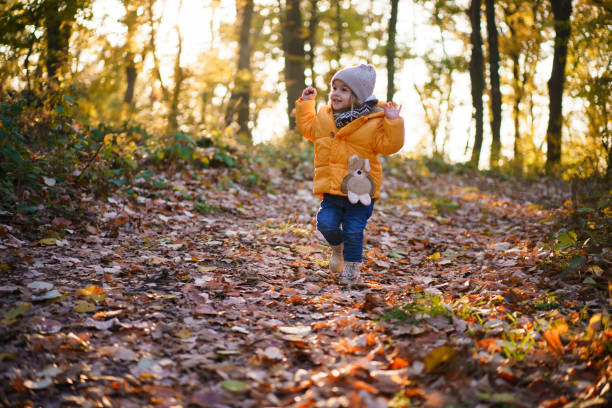 istock Girl walking in the forest during sunny day 2193063018