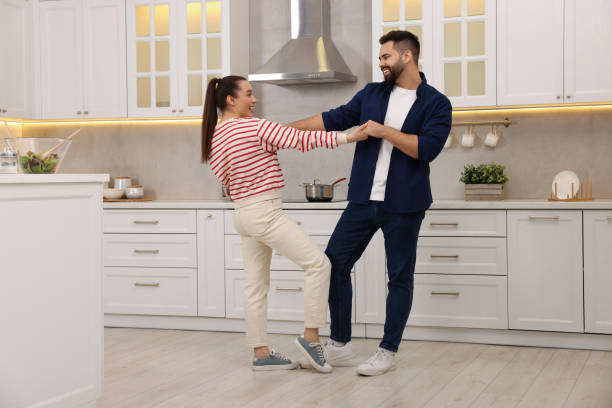 istock Happy lovely couple dancing together in kitchen 2193065586