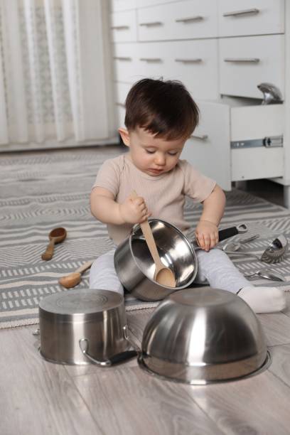 istock Cute little boy with cookware at home 2193066642