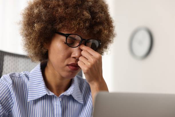 istock Woman suffering from headache in office, space for text 2193067854
