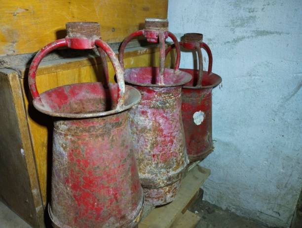 istock Storage of old fire equipment. Old red foam generators. 2193068059