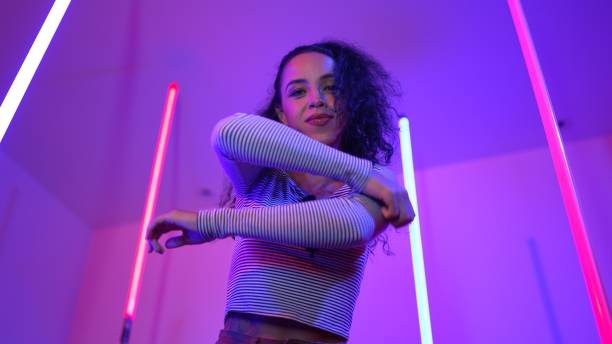 istock Low angle camera of hispanic dancer looking at camera and dancing. Regalement. 2193068122