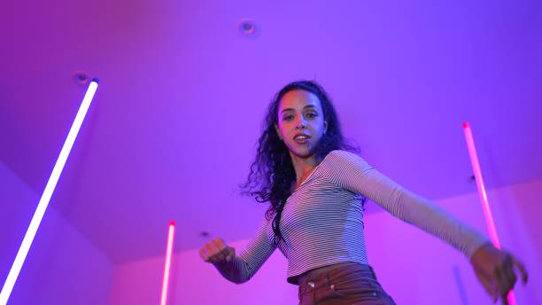 istock Low angle camera of hispanic dancer looking at camera and dancing. Regalement. 2193069748
