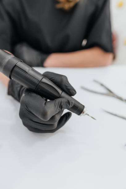 istock Professional nail drill in black gloves 2193070668