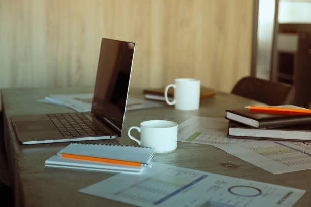 istock A laptop with a cup of coffee and documents on the table 2193070812