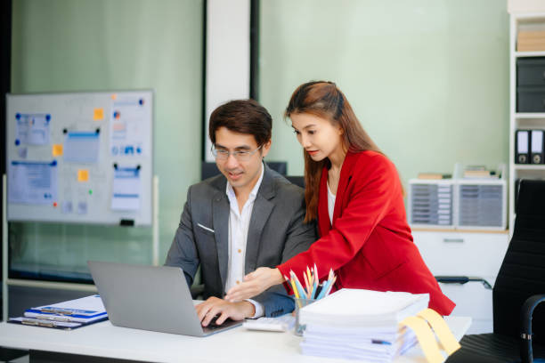 istock Happy businesspeople while collaborating on a new project in an office. 2193072553