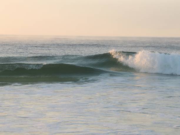 istock Serene ocean waves at sunrise 2193072578