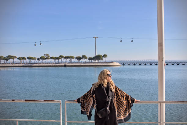 istock Stylish woman enjoying panoramic riverside 2193073877