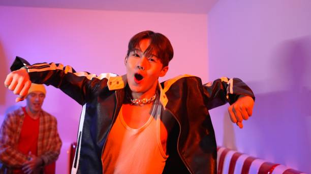 istock Asian break dancer perform freestyle movement and jumping at party. Regalement. 2193074499