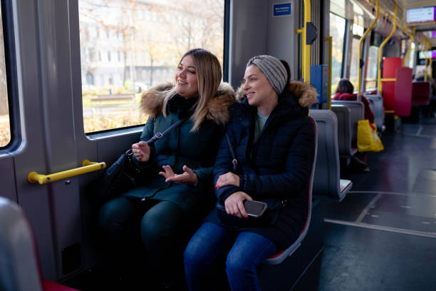 istock Women ride on the bus, talking and laughing. 2193074716