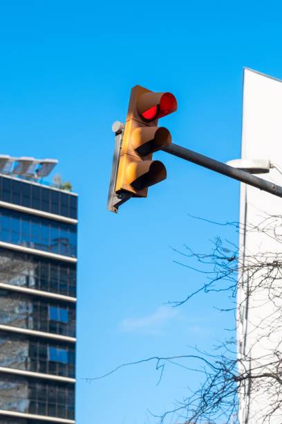 istock Traffic light with buildings and blue sky 2193075357