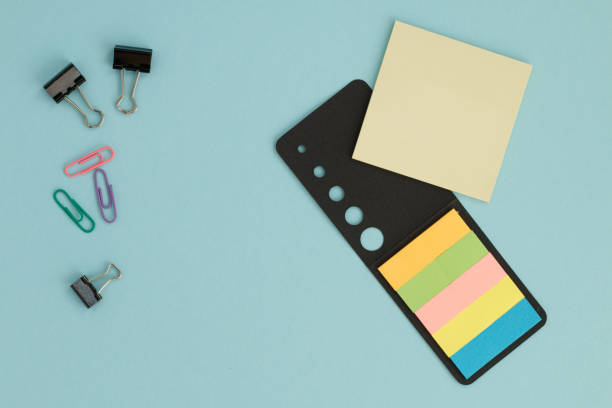 istock colorful office supplies on blue background 2193077958