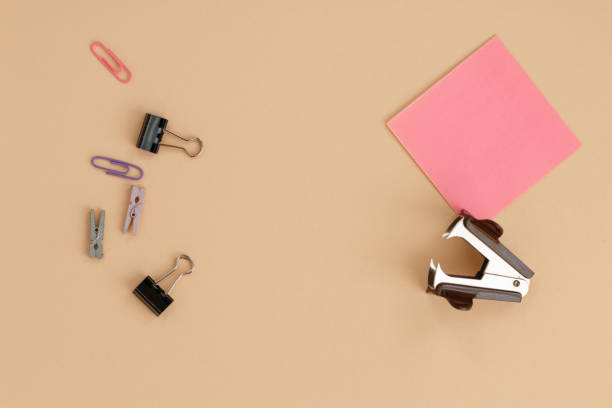 istock colorful office supplies on orange background 2193077959