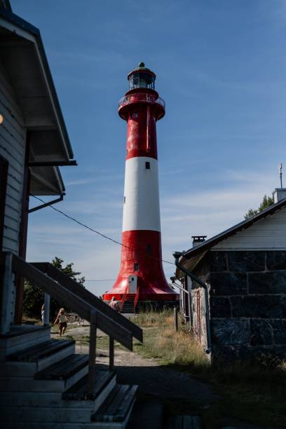 istock Vibrant red and white Tankar Lighthouse stands tall against a blue sky 2193078330