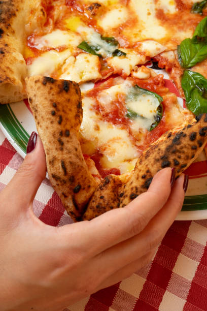 istock Traditional margherita pizza at a restaurant table 2193078899