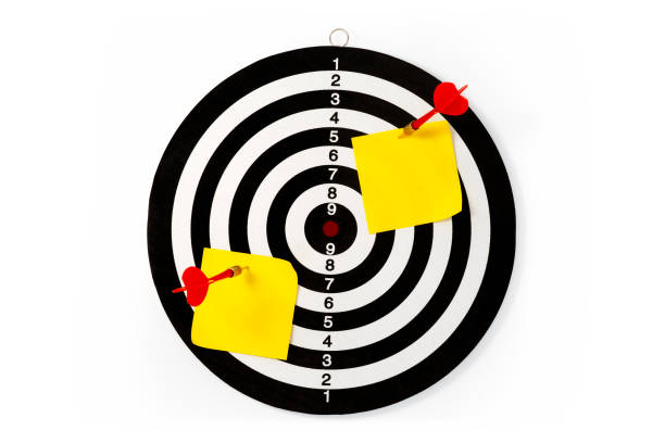 istock Dart board game with note paper isolated on a white background 2193078965