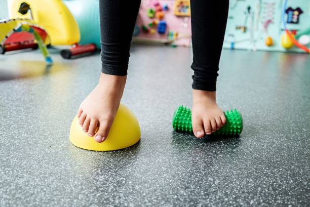 istock Child balancing on sensory equipment in playroom. 2193080470