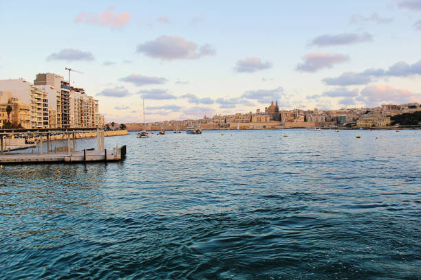 Valletta, Malta - December 20 2022: Malta Sunset Landscape with Valletta and Gzira, Sliema Cities. Panoramic View