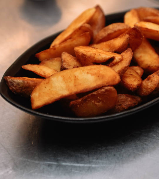 istock Potato wedges in a bowl, close-up, selective focus 2193084488