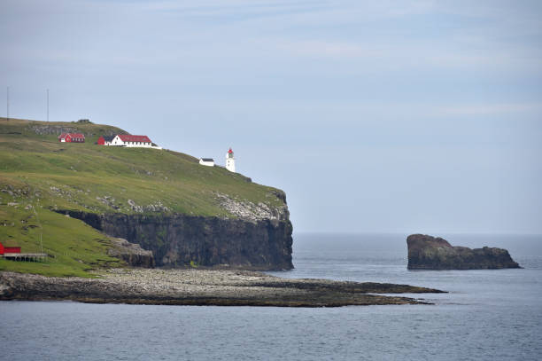 istock Old white lighthouse on the Faroe islands, Denmark 2193085893