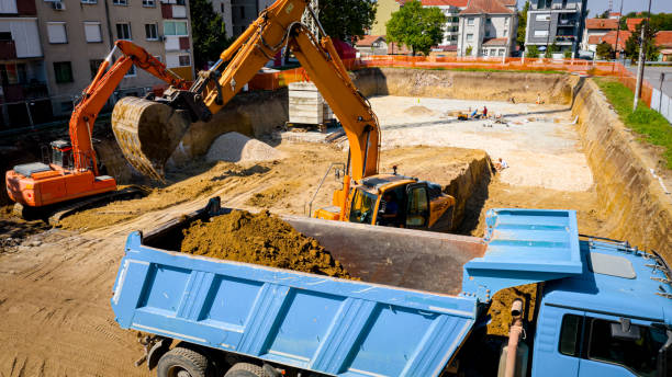 istock Ariel view excavator is loading a truck with ground on building site 2193086215