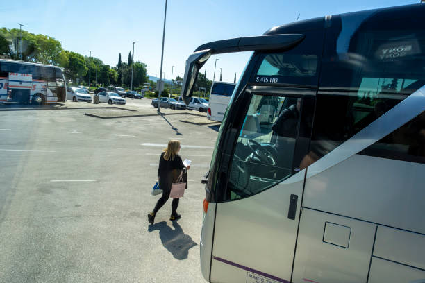 May, 2024, Dubrovnik Airport, Croatia: Dubrovnik the capital of Croatia.  There are tourists getting on busses at the airport to take them to their hotels.