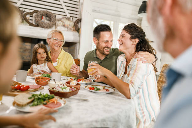 istock Happy extended family having a meal at dining table. 2193088018