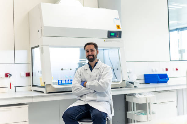 istock Scientist smiling with arms crossed in laboratory 2193088326