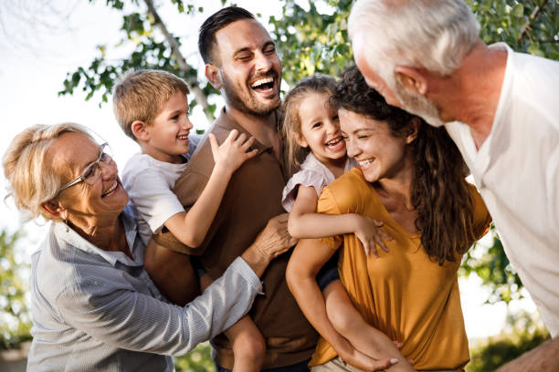 Cheerful extended family having fun in nature.
