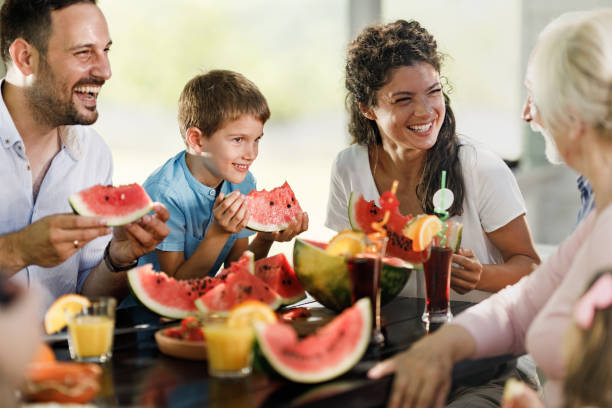 istock Happy multi-generation family enjoying in watermelon on a patio. 2193088636