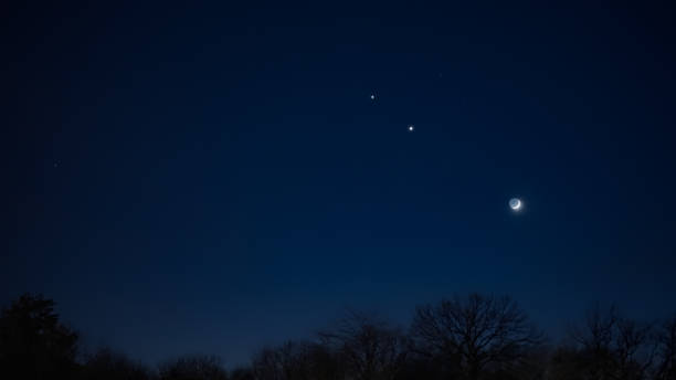 istock Crescent young Moon with stars, planets and countryside silhouettes. 2193091006