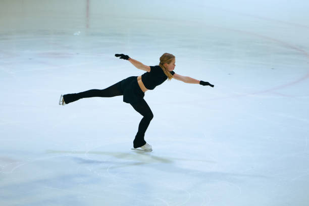 istock Figure skating girl training on ice arena. 2193091104