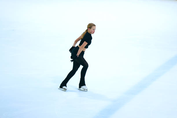 istock Figure skating girl training on ice arena. 2193091105