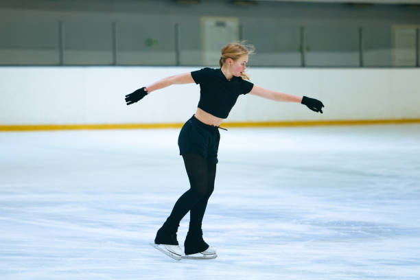 istock Figure skating girl training on ice arena. 2193091160