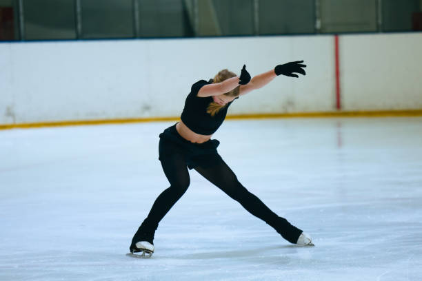 istock Figure skating girl training on ice arena. 2193091161