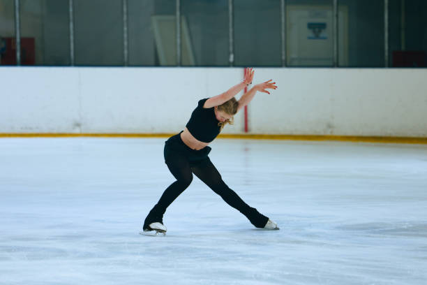 istock Figure skating girl training on ice arena. 2193091246