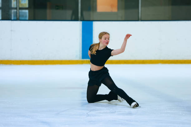 istock Figure skating girl training on ice arena. 2193091303