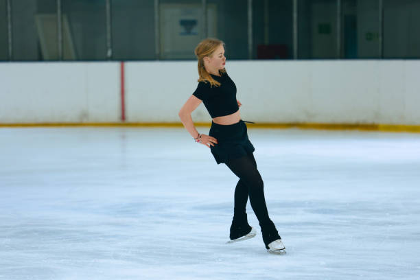 istock Figure skating girl training on ice arena. 2193091308