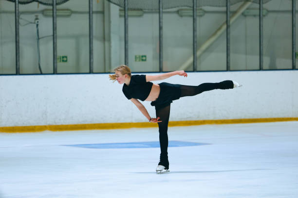 istock Figure skating girl training on ice arena. 2193091326