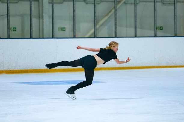 istock Figure skating girl training on ice arena. 2193091327